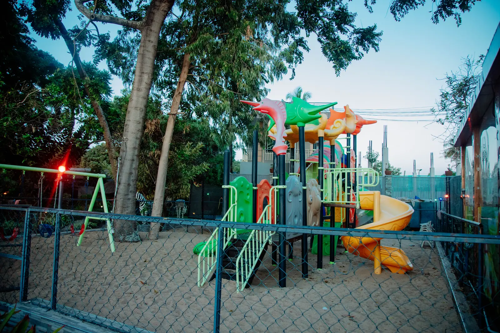 Kwatunza Child Corner playground with colorful slides and climbing frames